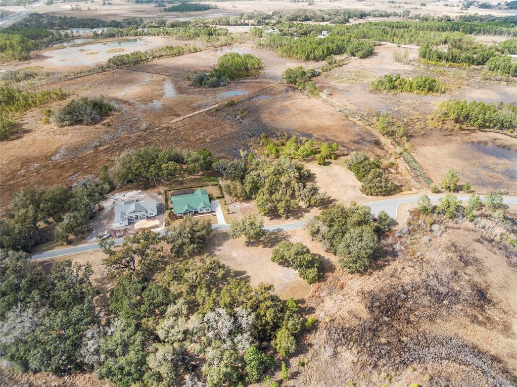 446 Long And Winding Road Howey-in-the-Hills, FL 34737 - Photo 10 of 32 a view of a lake with beach