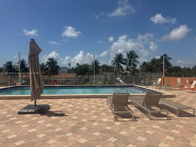 a view of a swimming pool with a sitting space