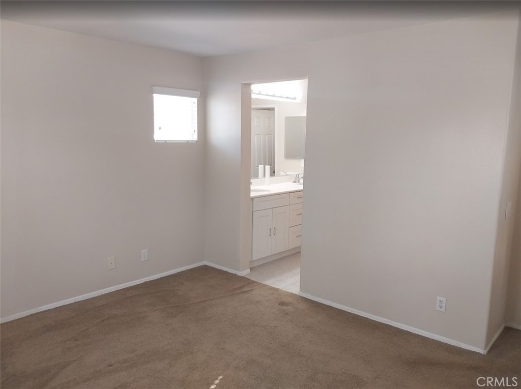 9772 Edenbrook Drive Riverside, CA 92503 - Photo 6 of 11 an empty room with windows