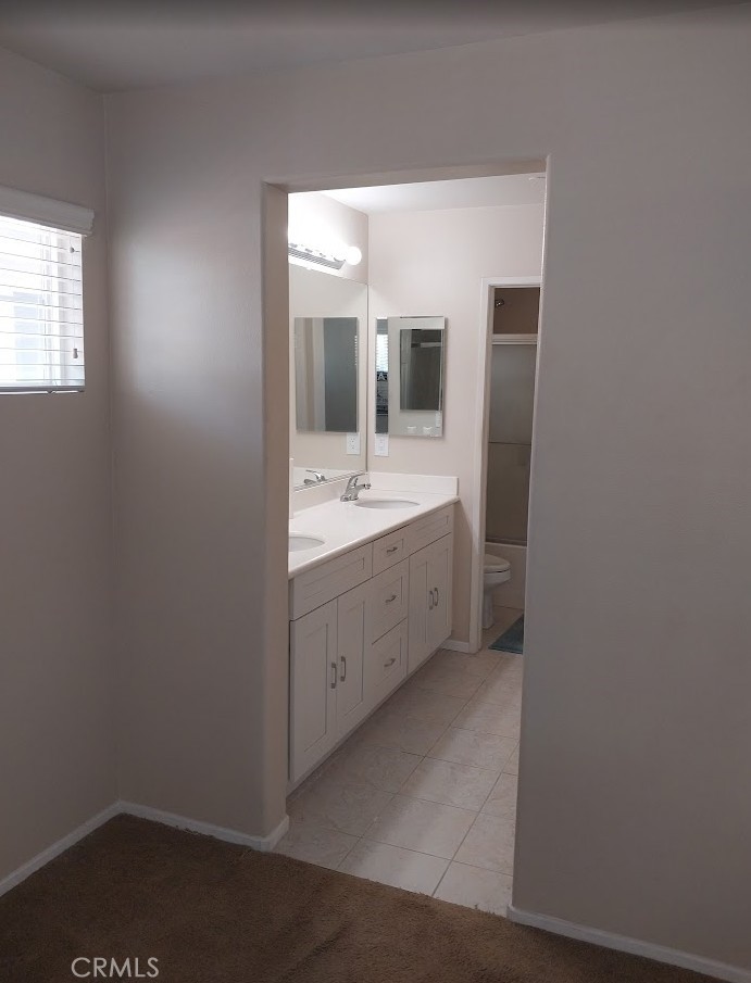 9772 Edenbrook Drive Riverside, CA 92503 - Photo 7 of 11 a bathroom with a sink and a mirror