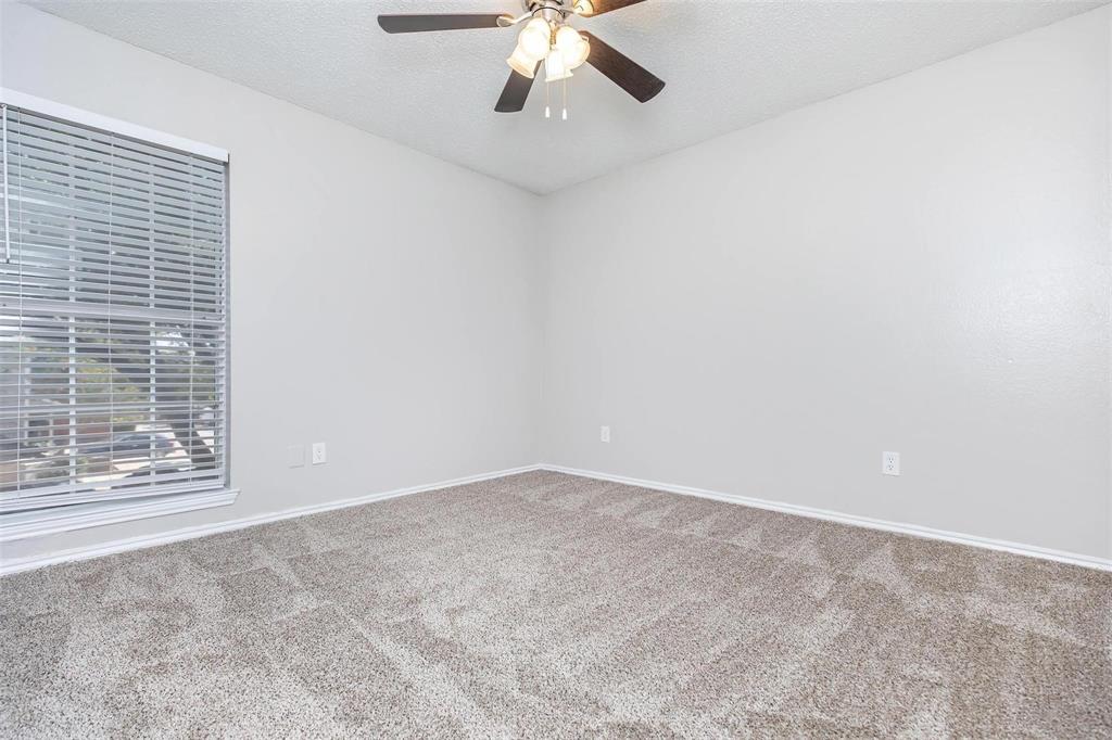 1826 Esters Road, Unit 2009 Irving, TX 75061 - Photo 24 of 39 The room features light-colored walls and a window with blinds