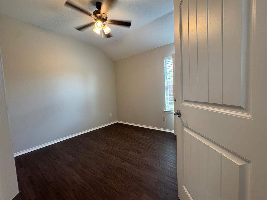 117 Chalk Road Anna, TX 75409 - Photo 12 of 32 an empty room with wooden floor closet and windows
