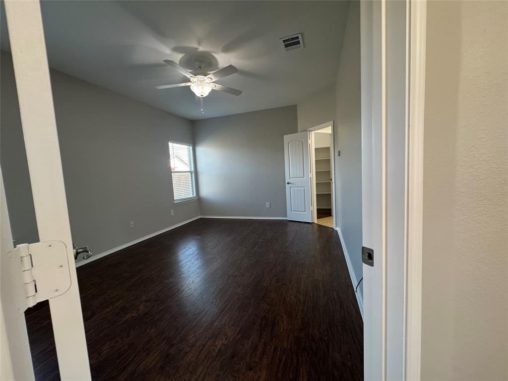117 Chalk Road Anna, TX 75409 - Photo 13 of 32 an empty room with wooden floor and windows