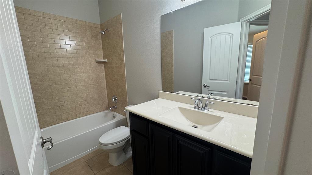 117 Chalk Road Anna, TX 75409 - Photo 22 of 32 a bathroom with a sink a toilet and shower