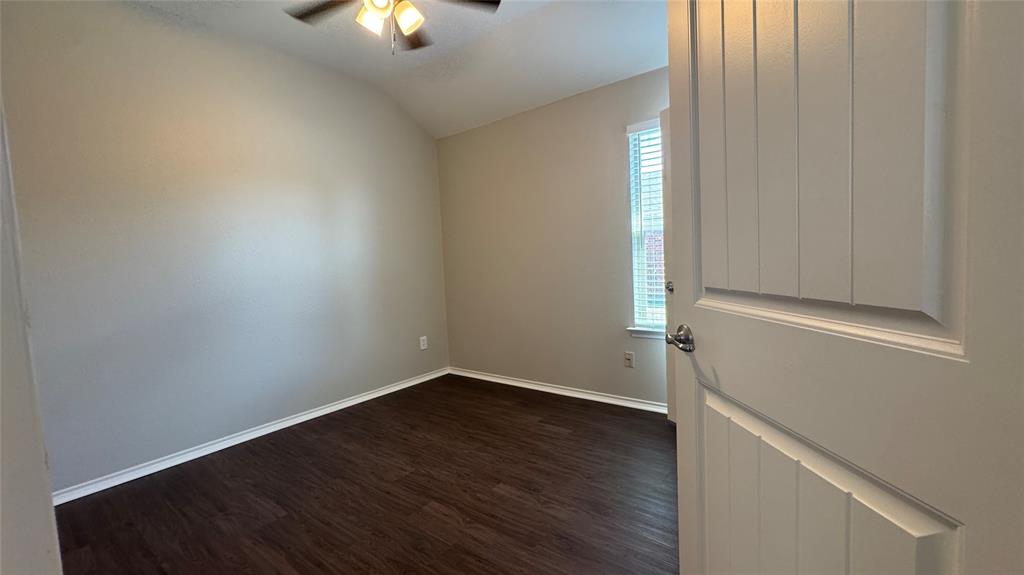 117 Chalk Road Anna, TX 75409 - Photo 23 of 32 an empty room with wooden floor and windows