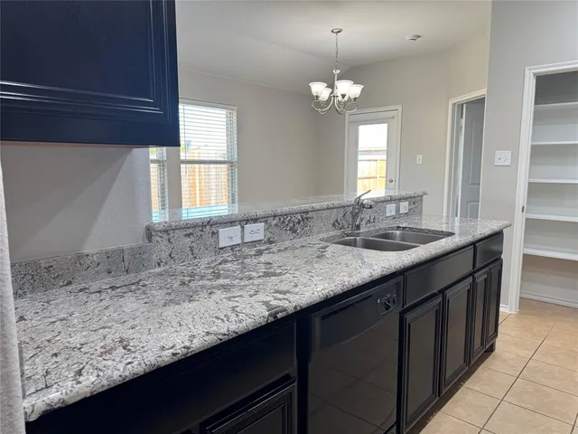 a bathroom with a sink a vanity and a large mirror