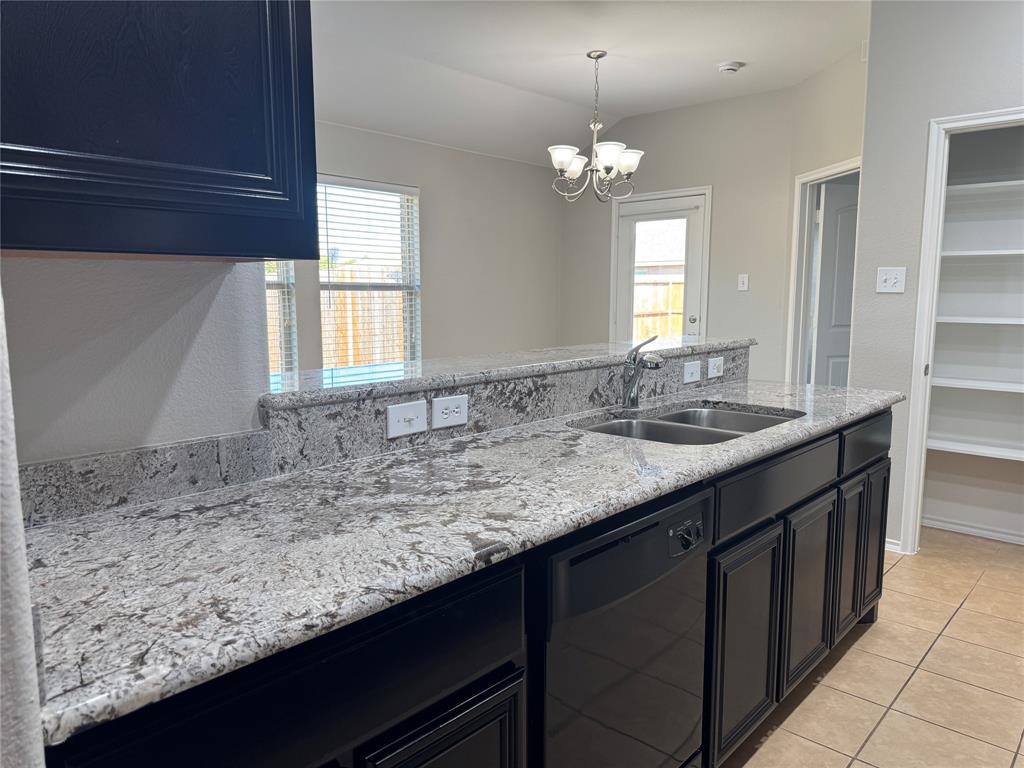 117 Chalk Road Anna, TX 75409 - Photo 5 of 32 a bathroom with a sink a vanity and a large mirror