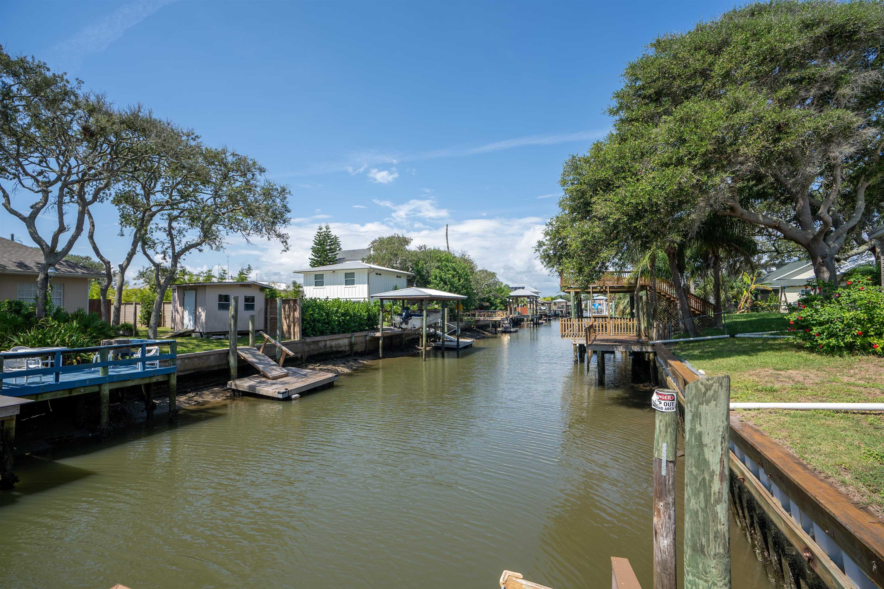 231 Ventura Road St. Augustine, FL 32080 - Photo 13 of 47 a view of swimming pool with outdoor seating and trees in the background