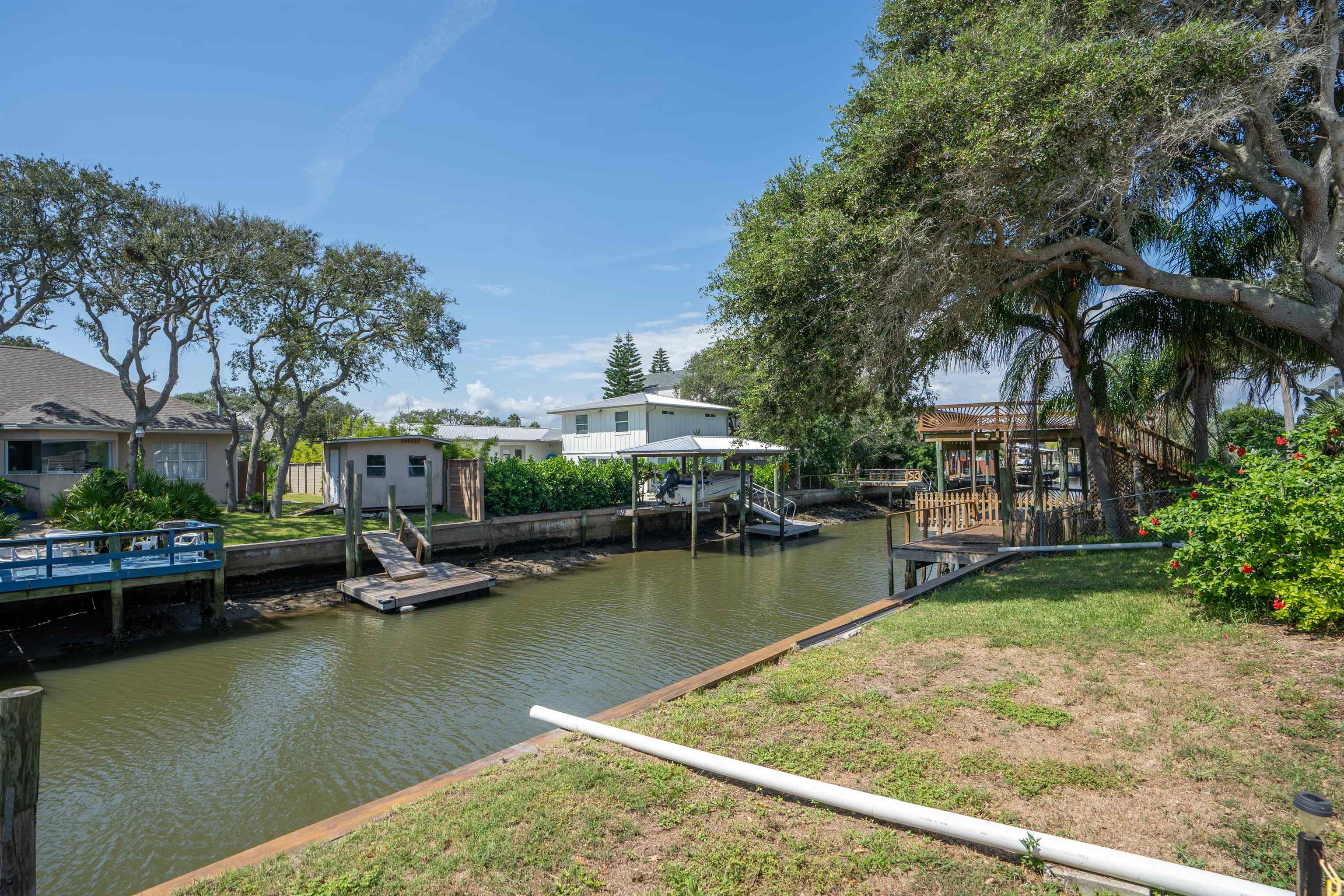 231 Ventura Road St. Augustine, FL 32080 - Photo 17 of 47 a view of swimming pool with outdoor seating and lake view