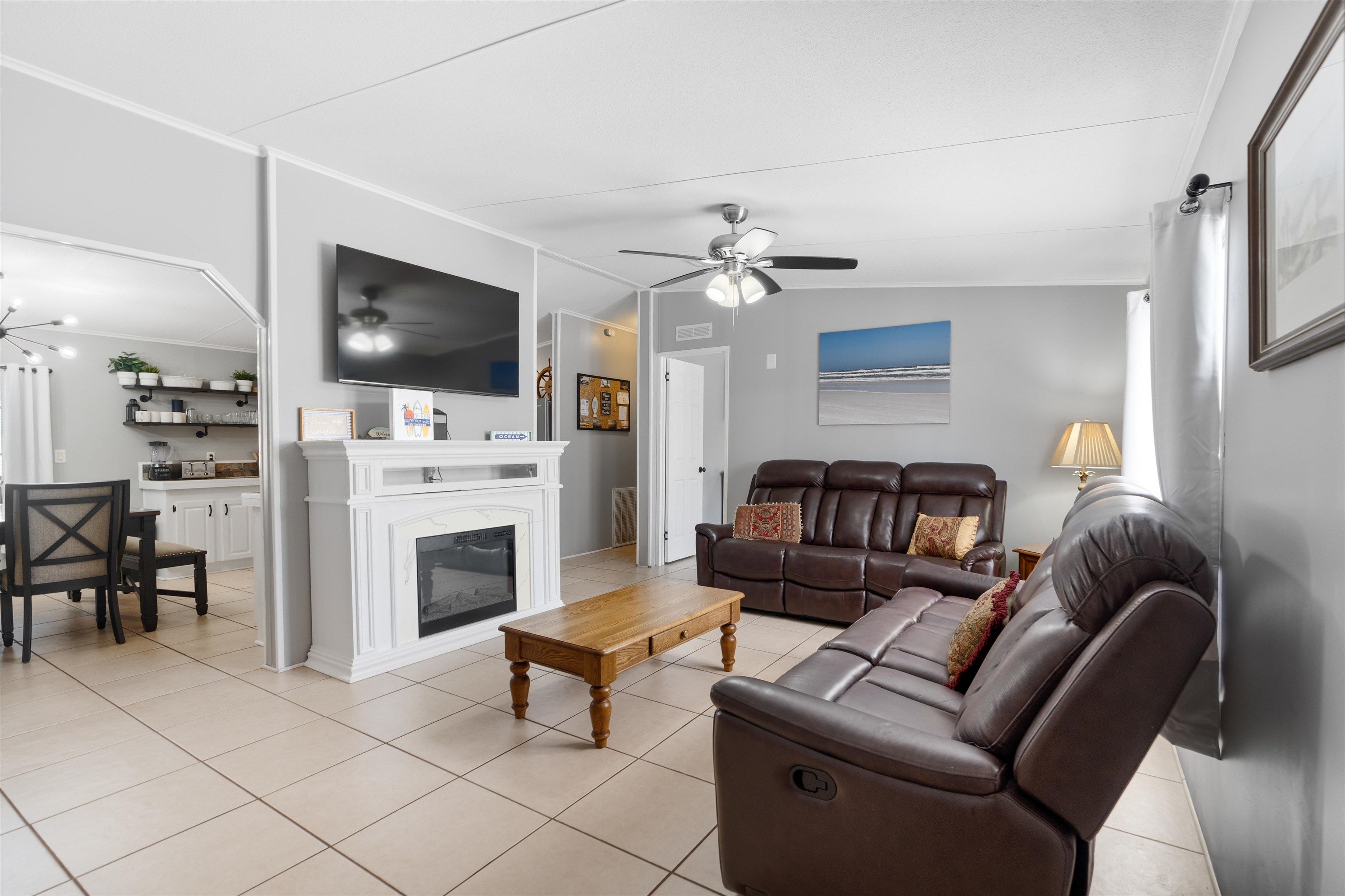 231 Ventura Road St. Augustine, FL 32080 - Photo 22 of 47 a living room with furniture a fireplace and a flat screen tv