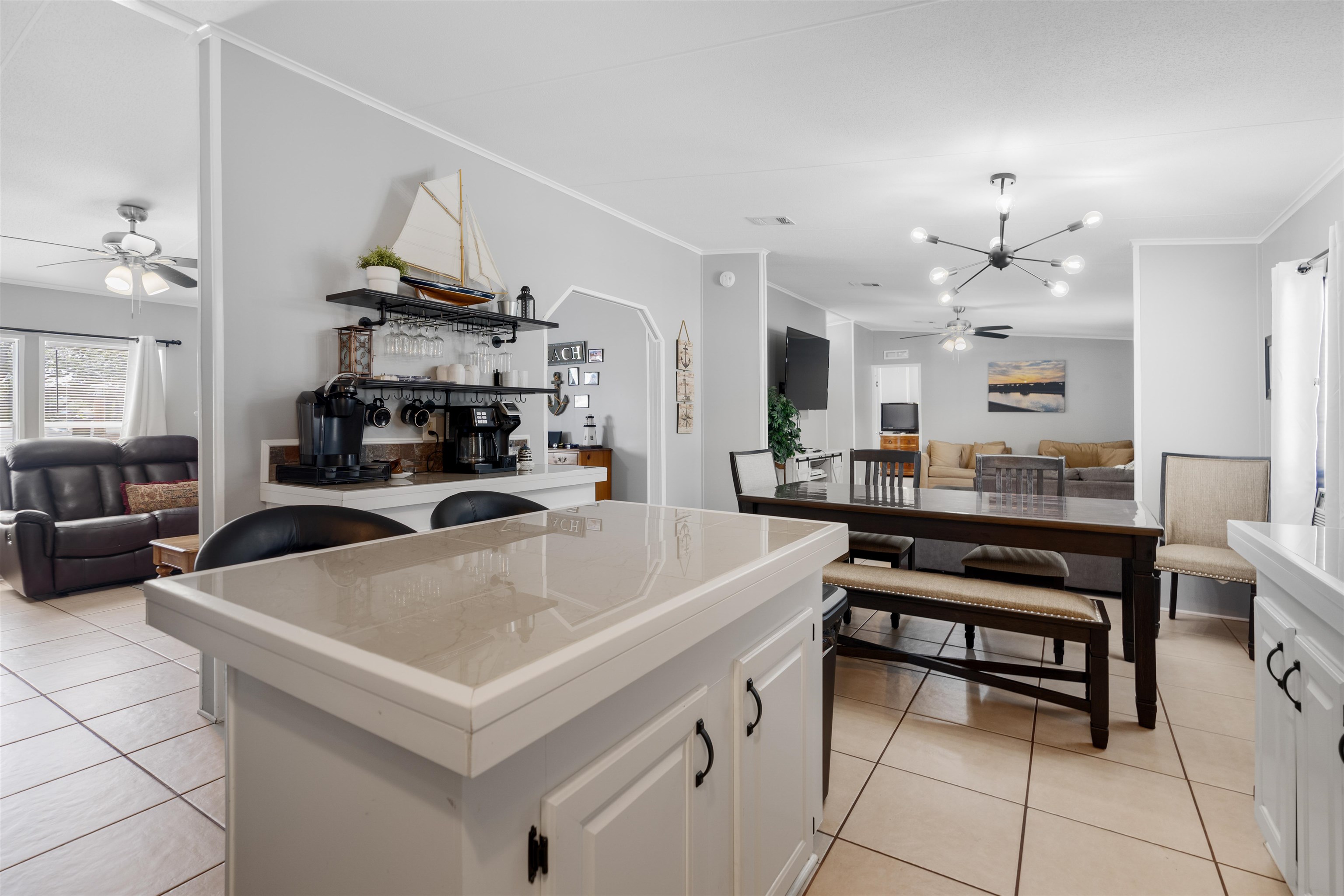231 Ventura Road St. Augustine, FL 32080 - Photo 25 of 47 a living room with stainless steel appliances a table chairs and a kitchen view