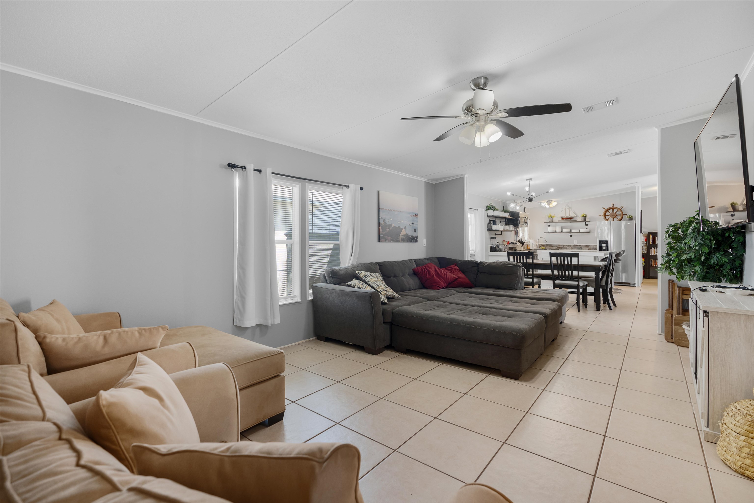 231 Ventura Road St. Augustine, FL 32080 - Photo 28 of 47 a living room with furniture and a chandelier