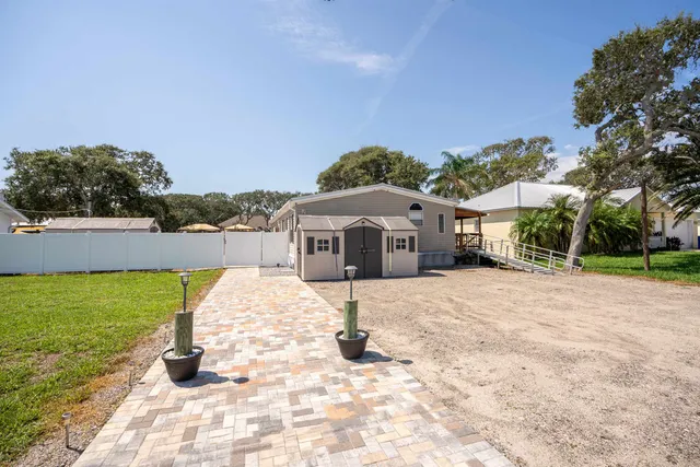 a view of a garden with a house
