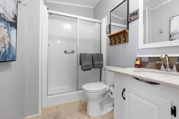 a bathroom with a toilet and a shower