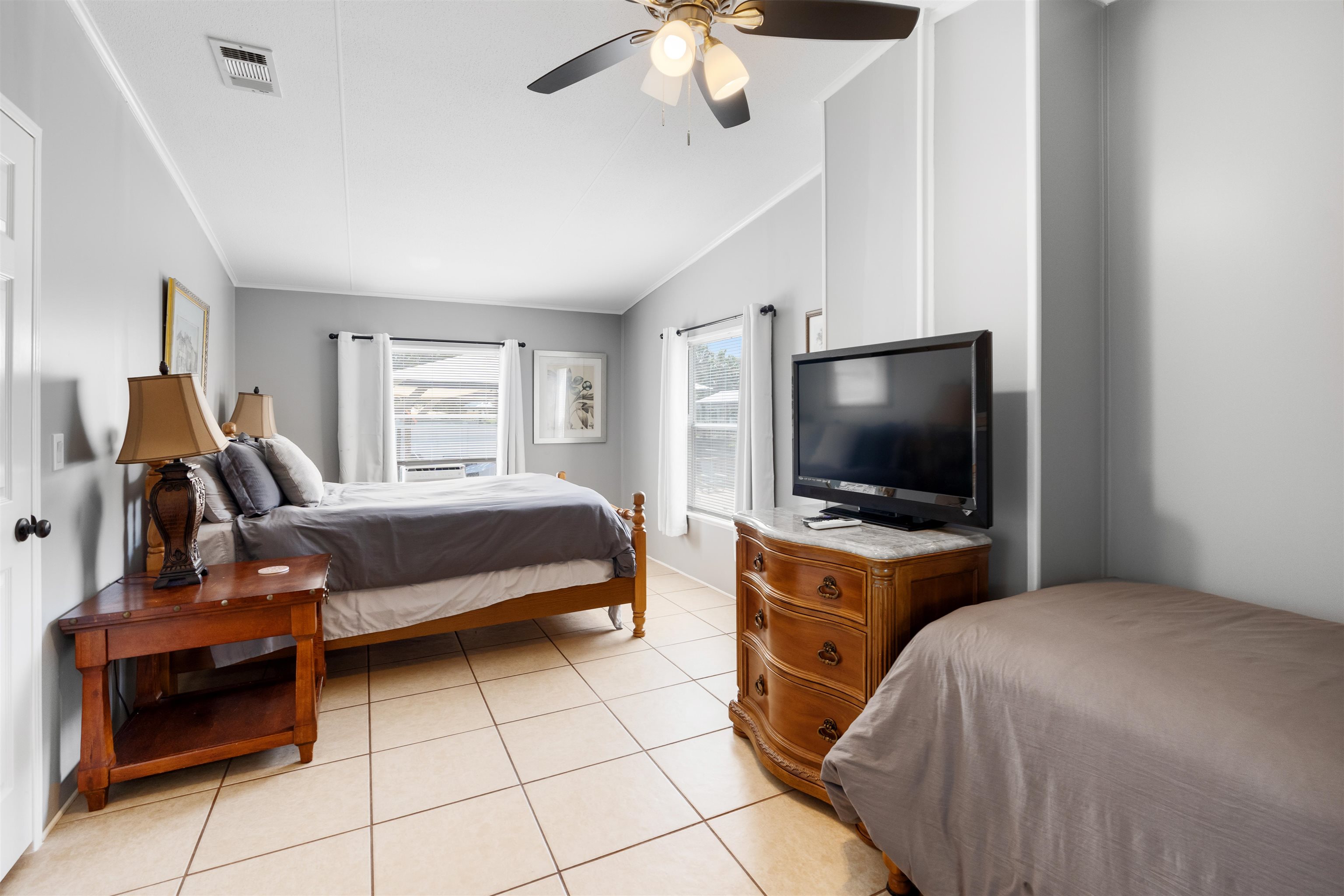 231 Ventura Road St. Augustine, FL 32080 - Photo 32 of 47 a bedroom with a bed and a flat screen tv