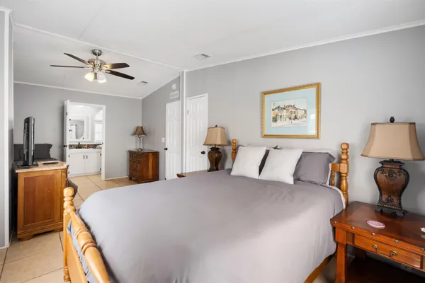 a bed room with a bed and dresser