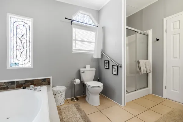 a bathroom with a toilet sink and a shower