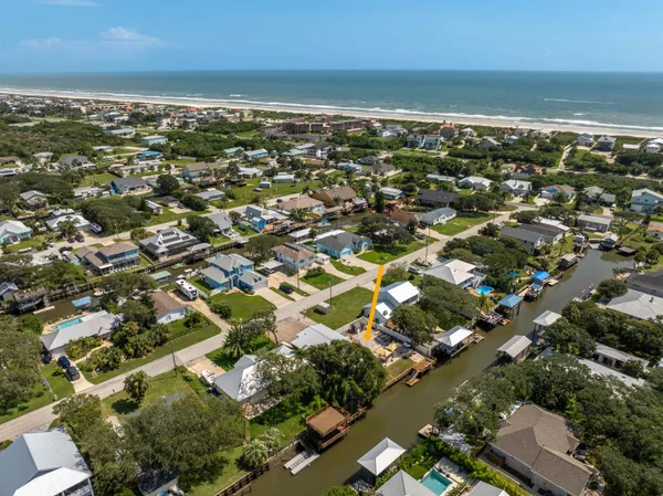 an aerial view of residential building with ocean view