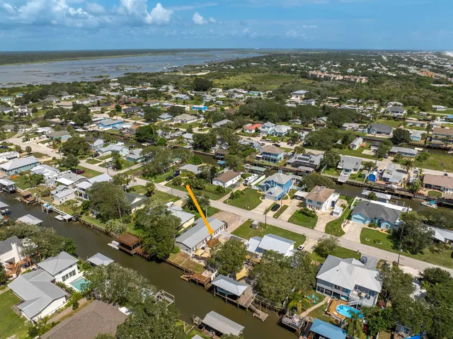 an aerial view of residential building with parking