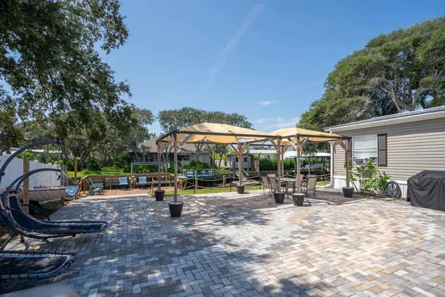 a view of a backyard with a patio