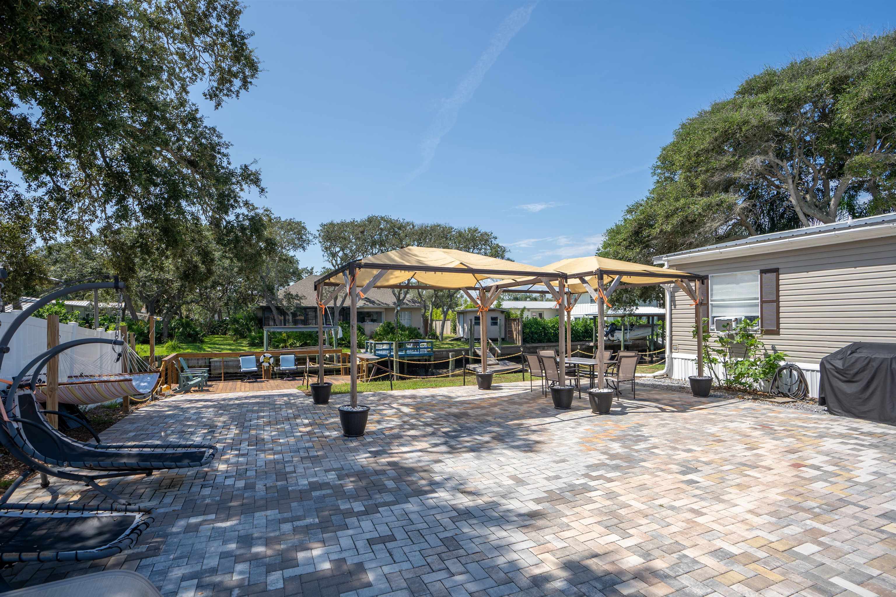 231 Ventura Road St. Augustine, FL 32080 - Photo 8 of 47 a view of a backyard with a patio