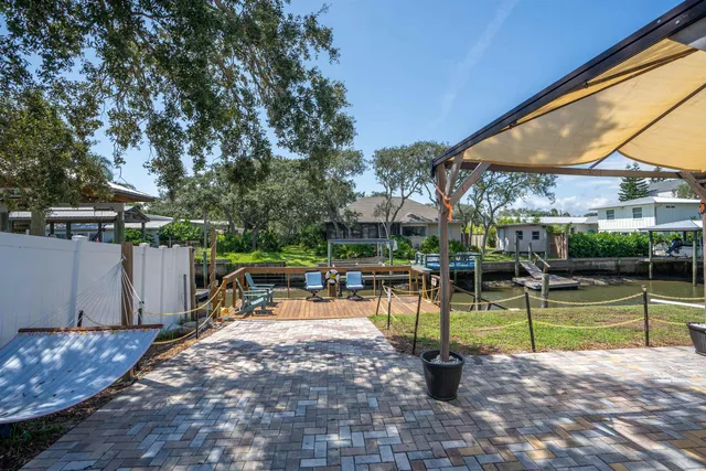 a view of a swimming pool with a patio