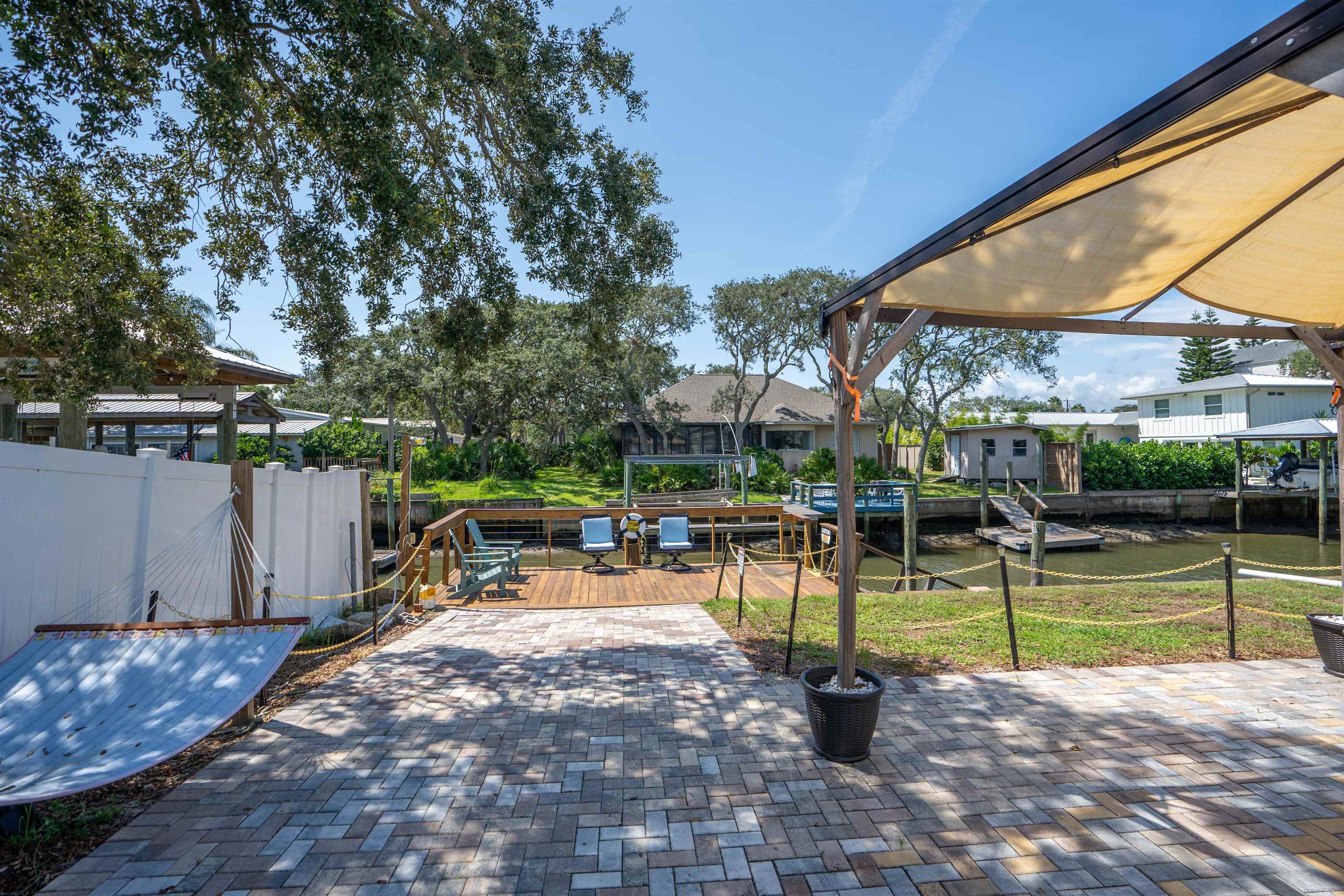231 Ventura Road St. Augustine, FL 32080 - Photo 9 of 47 a view of a swimming pool with a patio