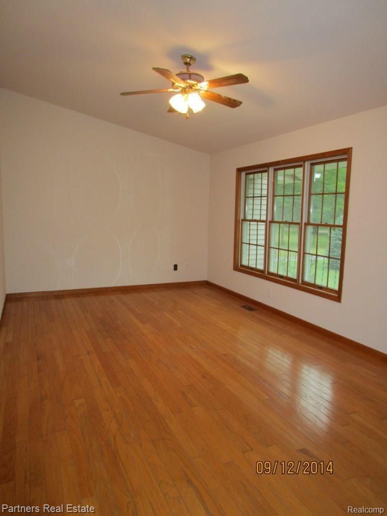 6221 North Nicholson Road Fowlerville, MI 48836 - Photo 2 of 21 Living Room.jpg