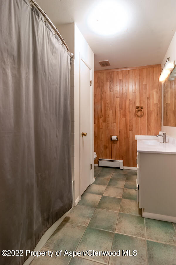 341 Clarkson Avenue Rifle, CO 81650 - Photo 14 of 16 a view of a bathroom with tub and shower