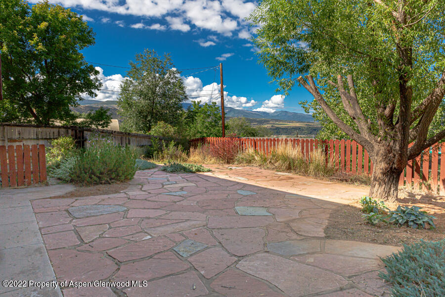 341 Clarkson Avenue Rifle, CO 81650 - Photo 3 of 16 a view of a street with a tree in the background