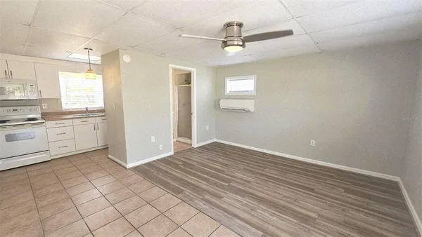 a view of a kitchen with microwave and cabinets
