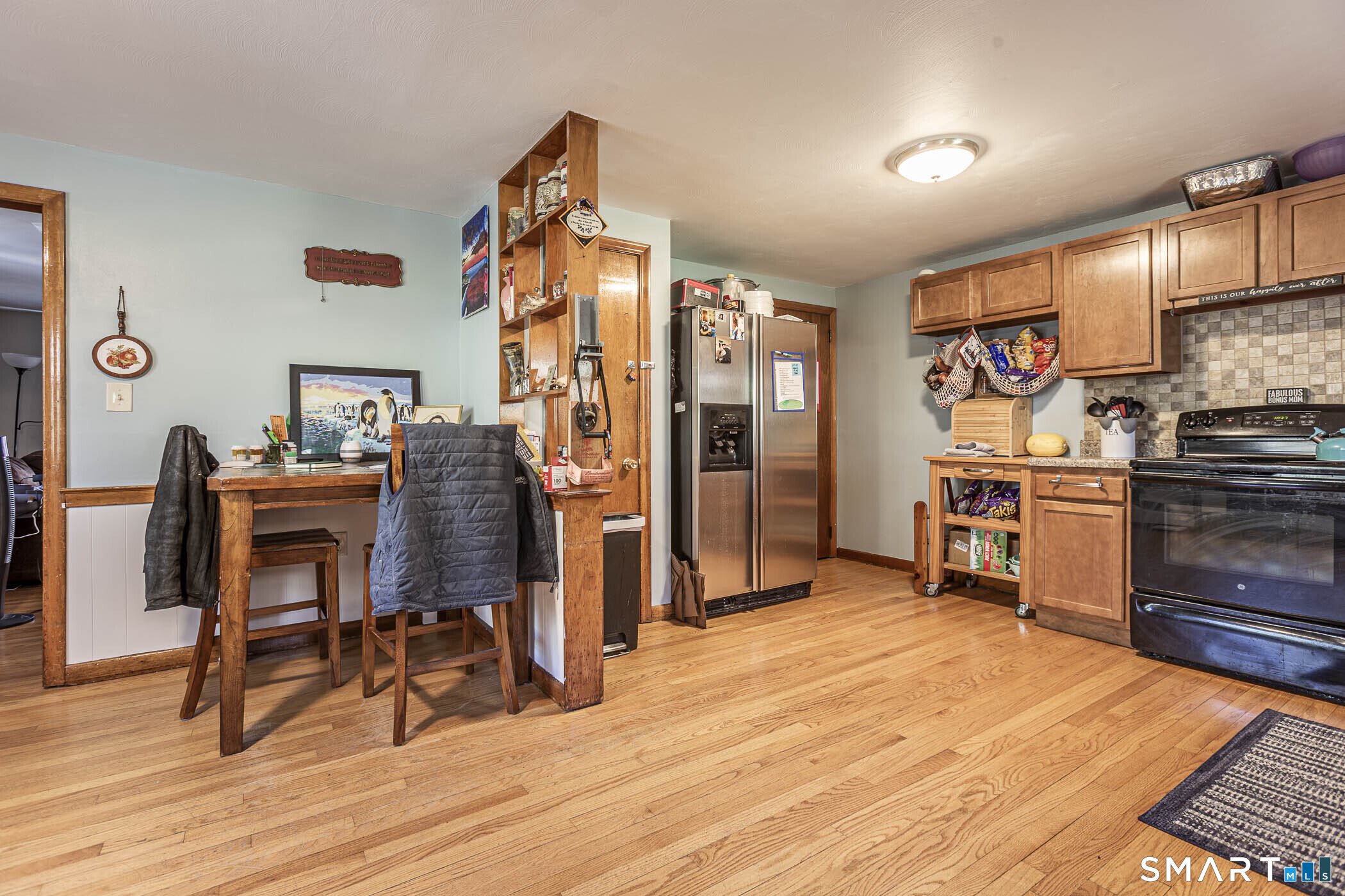 146 Union Street Manchester, CT 06042 - Photo 13 of 27 a view of a kitchen with dining area wooden floor and a window