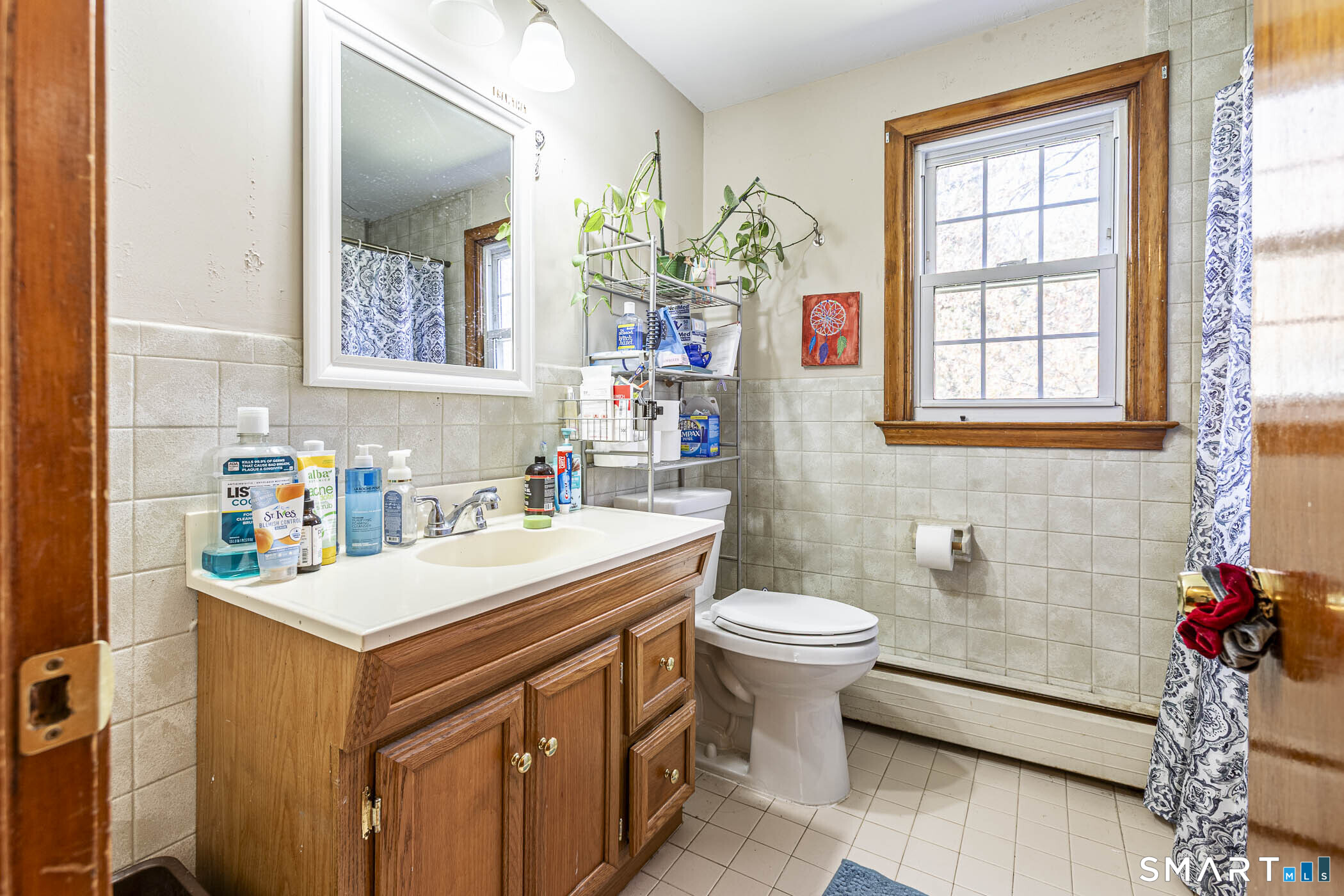 146 Union Street Manchester, CT 06042 - Photo 14 of 27 a bathroom with a sink mirror and a toilet