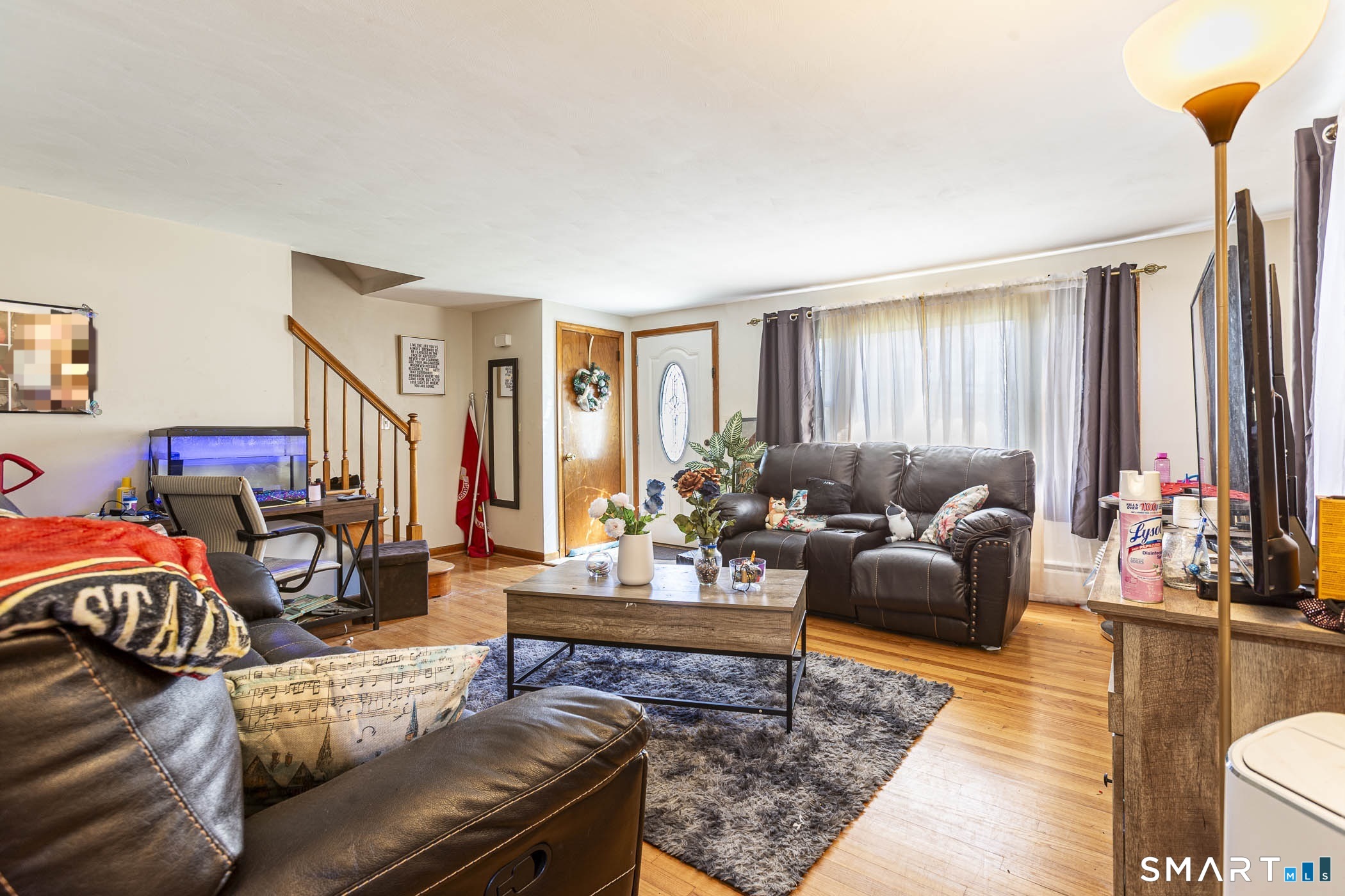 146 Union Street Manchester, CT 06042 - Photo 20 of 27 a living room with furniture and a flat screen tv