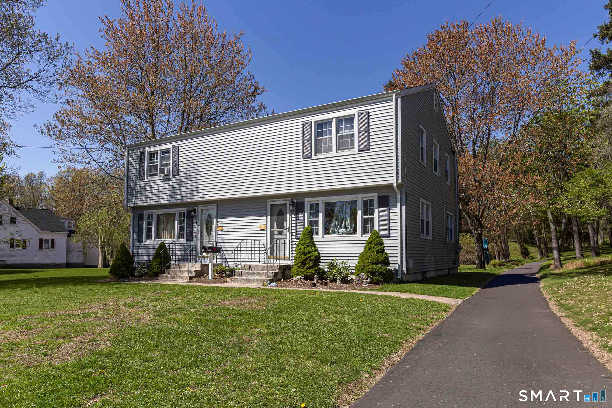 146 Union Street Manchester, CT 06042 - Photo 2 of 27 a front view of house with yard and green space