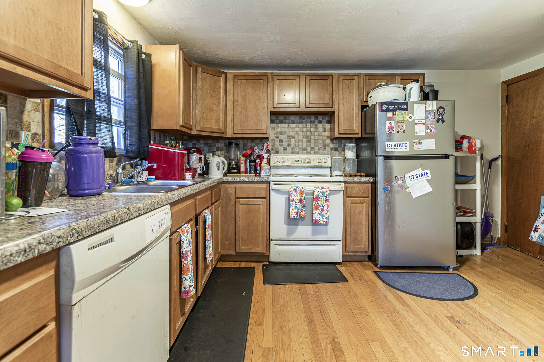 146 Union Street Manchester, CT 06042 - Photo 22 of 27 a kitchen with stainless steel appliances granite countertop a refrigerator a stove and a sink