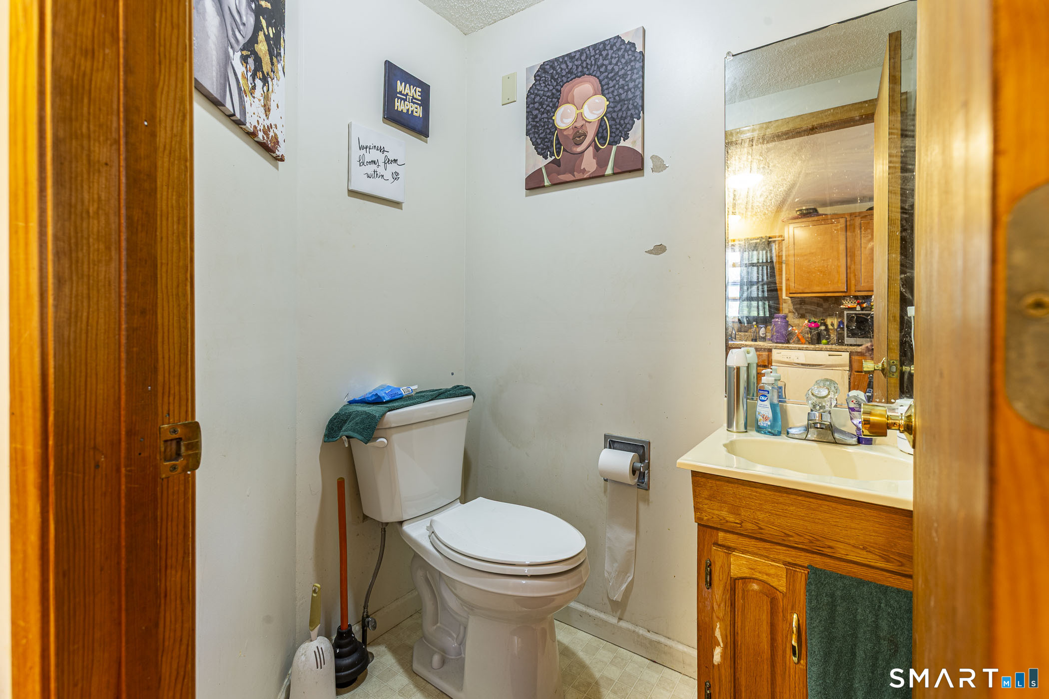 146 Union Street Manchester, CT 06042 - Photo 25 of 27 a white toilet sitting next to a bathroom sink
