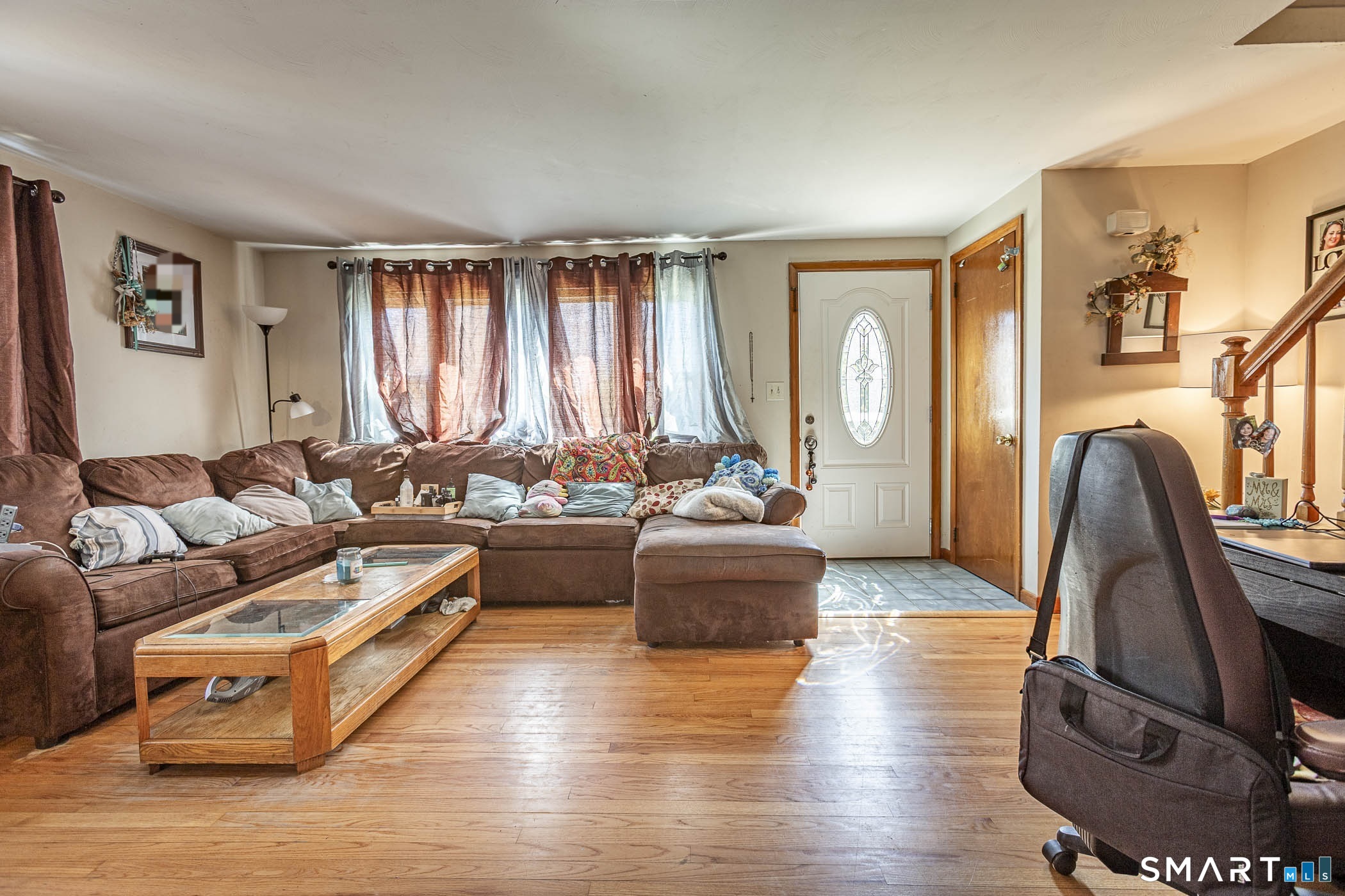 146 Union Street Manchester, CT 06042 - Photo 9 of 27 a living room with furniture and a large window