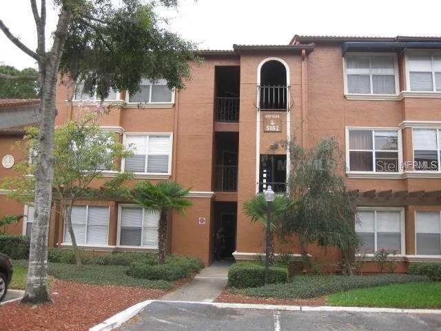 5152 Conroy Road, Unit 16 Orlando, FL 32811 - Photo 1 of 1 a front view of a house with a yard