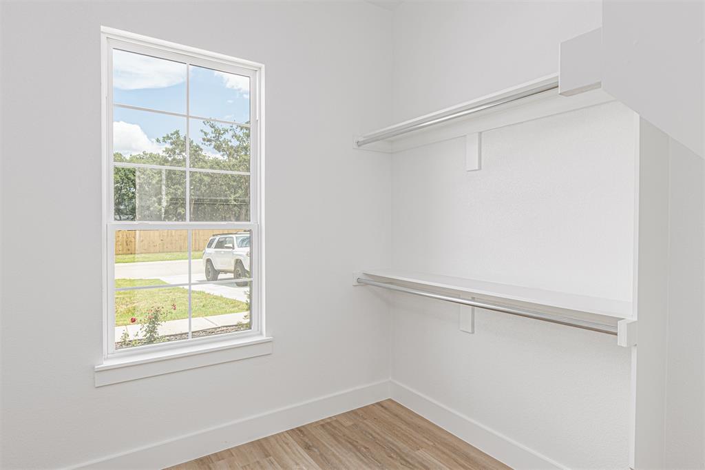 360 Dalton Road Canton, TX 75103 - Photo 19 of 33 Closet featuring wood-finish flooring, white walls, and a window with grid panes