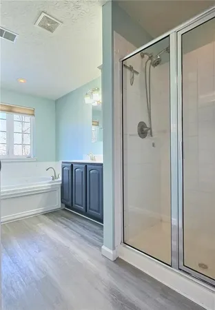 a view of a livingroom with a ceiling fan and window