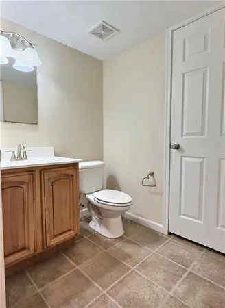 a view of an empty room with a fireplace