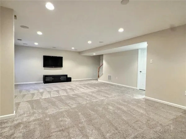 a view of backyard with wooden floor
