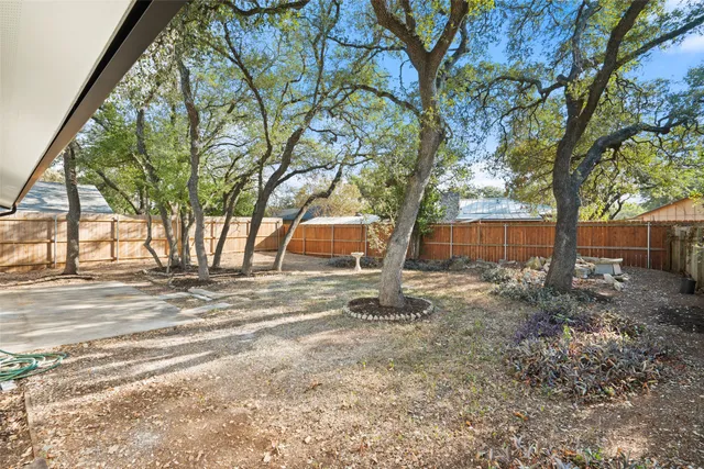 a backyard of a house with lots of green space