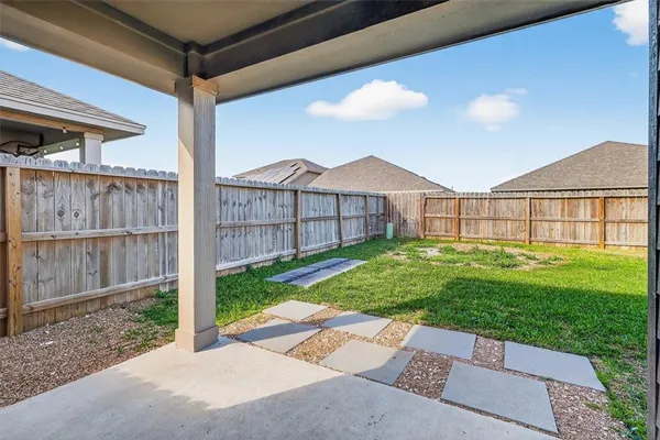 a view of a backyard with a garden and plants