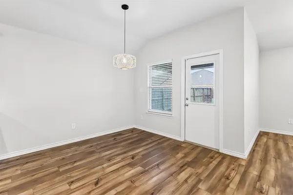 a view of empty room with windows