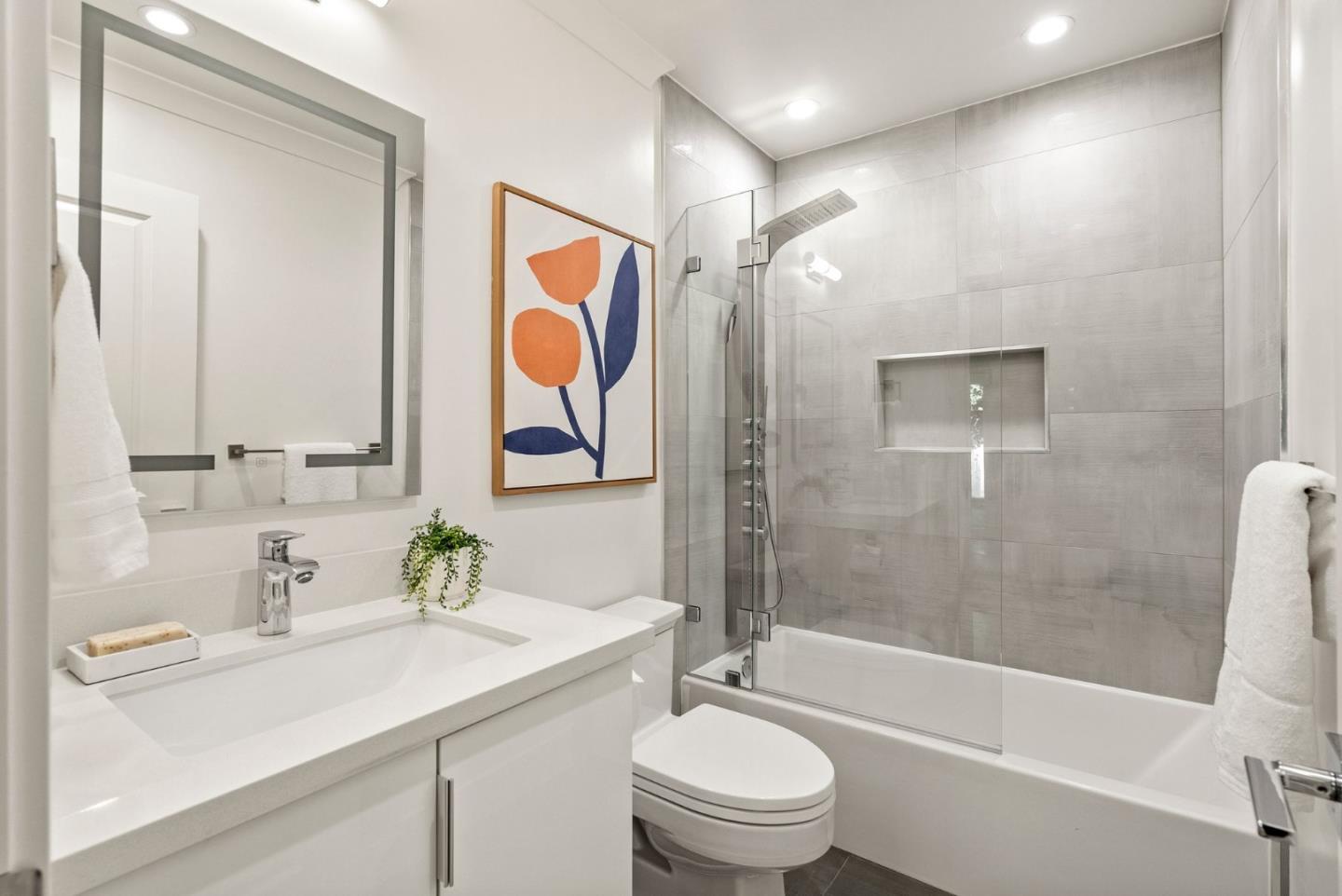 625 Kingsley Avenue Palo Alto, CA 94301 - Photo 16 of 24 a bathroom with a sink a toilet and shower