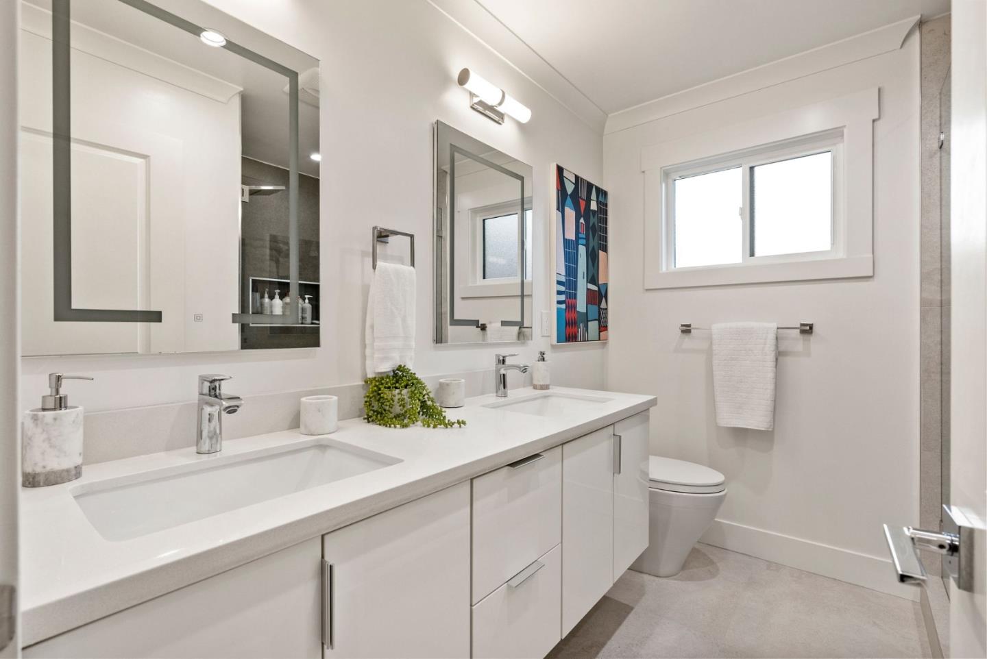 625 Kingsley Avenue Palo Alto, CA 94301 - Photo 19 of 24 a bathroom with a double vanity sink mirror and toilet