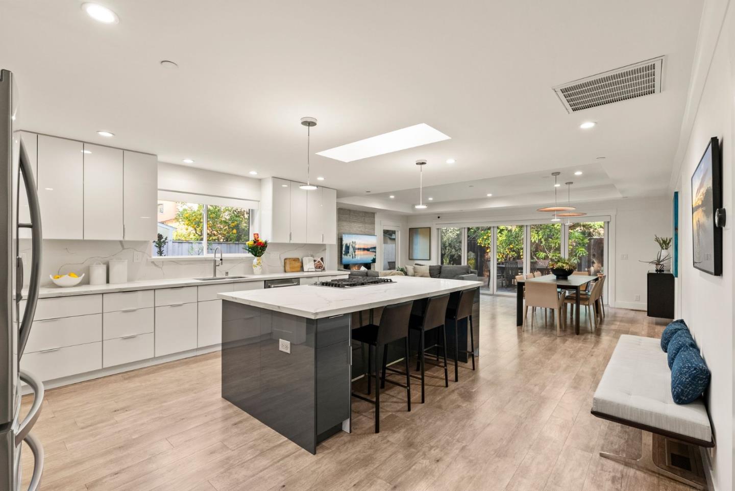625 Kingsley Avenue Palo Alto, CA 94301 - Photo 4 of 24 a kitchen with lots of counter top space and dining table