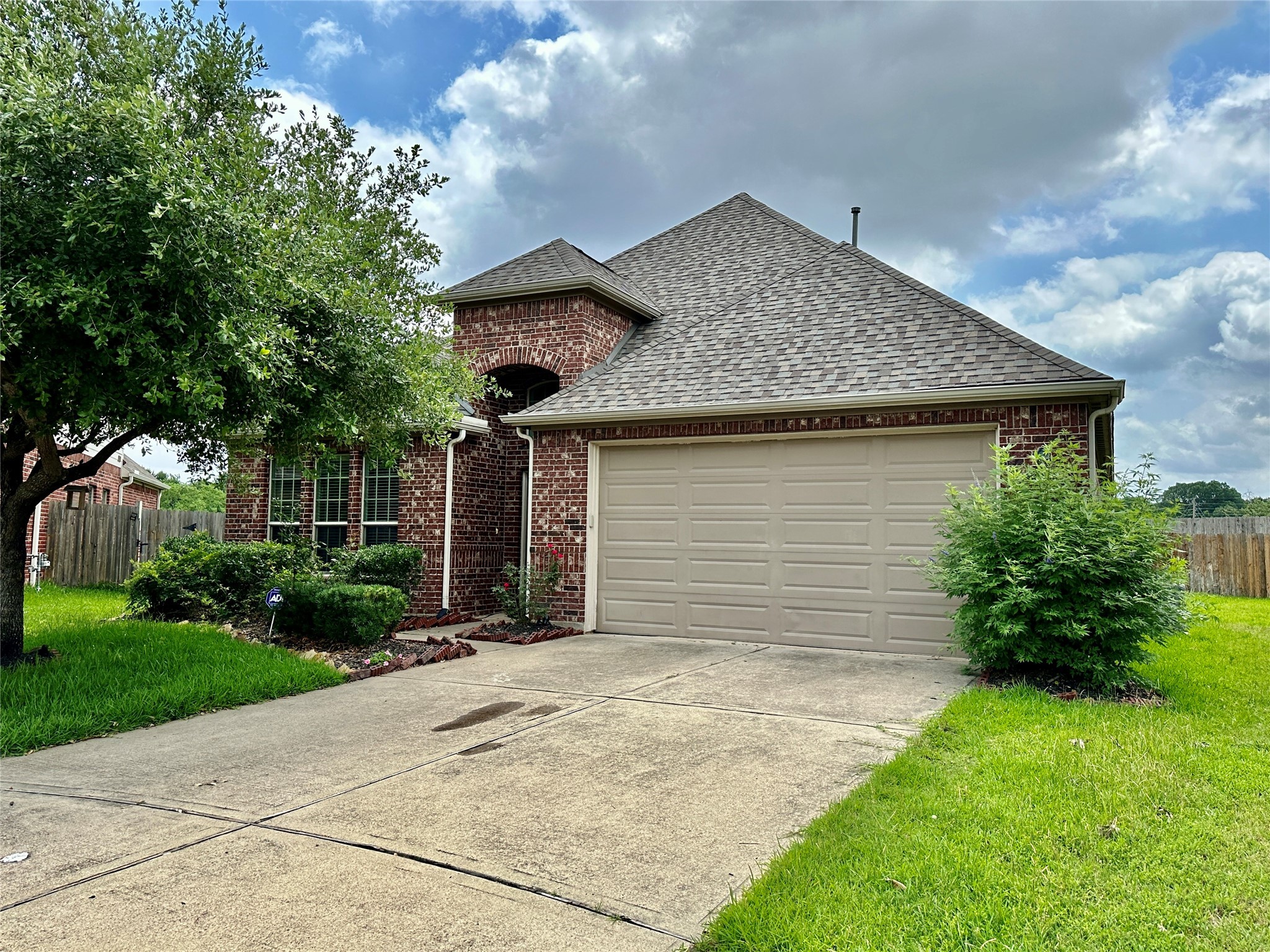 25307 Holton Ridge Drive Katy, TX 77494 - Photo 1 of 26 a front view of house with yard and trees